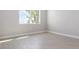 Bright bedroom with large window and tile flooring at 2630 Beeville Ave, North Port, FL 34286