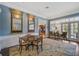 Formal dining room with a wood table and access to a sunroom at 325 Osprey Point Dr, Osprey, FL 34229