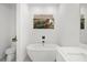 Bathroom with a free-standing bathtub at 577 Venice Ln, Sarasota, FL 34242