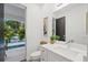 Bathroom with pool view and modern vanity at 577 Venice Ln, Sarasota, FL 34242