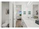 Bathroom with toilet and view into bedroom at 577 Venice Ln, Sarasota, FL 34242