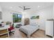 Bright bedroom with large window, hardwood floors, and built-in workspace at 577 Venice Ln, Sarasota, FL 34242