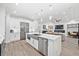 Modern kitchen with stainless steel appliances and a large island at 577 Venice Ln, Sarasota, FL 34242