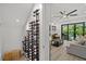 Modern wine cellar with numerous bottles on display at 577 Venice Ln, Sarasota, FL 34242