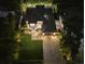 Night aerial view of a modern house with a paved driveway and landscaping at 577 Venice Ln, Sarasota, FL 34242