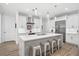 Modern kitchen with white cabinets, large island, and stainless steel appliances at 577 Venice Ln, Sarasota, FL 34242