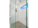 Walk-in shower with glass enclosure and hexagon floor tile at 577 Venice Ln, Sarasota, FL 34242