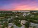 Aerial view of a waterfront community with a modern house at 577 Venice Ln, Sarasota, FL 34242