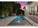 Inviting pool area with surrounding patio and palm trees at 577 Venice Ln, Sarasota, FL 34242