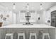 Modern kitchen with white cabinets, large island, and stainless steel appliances at 577 Venice Ln, Sarasota, FL 34242