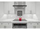 Modern kitchen with stainless steel appliances and white cabinets at 577 Venice Ln, Sarasota, FL 34242