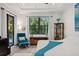 Main bedroom with a king-size bed, sitting area, and private balcony access at 577 Venice Ln, Sarasota, FL 34242