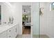 Bathroom with double vanity and view of bedroom at 577 Venice Ln, Sarasota, FL 34242