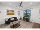 Relaxing bedroom with a comfortable couch, work area, and large window at 577 Venice Ln, Sarasota, FL 34242