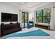 Bedroom with king-size bed and large TV at 577 Venice Ln, Sarasota, FL 34242