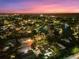 Night aerial view of a residential neighborhood near the water at 577 Venice Ln, Sarasota, FL 34242