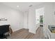 Bedroom with built-in shelving and access to bathroom at 577 Venice Ln, Sarasota, FL 34242