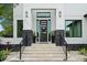 Modern home with a sleek front door and stone accents at 577 Venice Ln, Sarasota, FL 34242