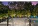 Inviting pool and patio with lush landscaping and seating at 577 Venice Ln, Sarasota, FL 34242