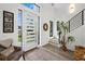 Spacious entryway with a modern door and plenty of natural light at 577 Venice Ln, Sarasota, FL 34242