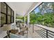 Relaxing pool deck with patio furniture and lush landscaping at 577 Venice Ln, Sarasota, FL 34242