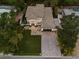 Night aerial view of a modern house with a paved driveway and landscaping at 577 Venice Ln, Sarasota, FL 34242