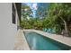 Private rectangular pool with a fountain and plenty of surrounding patio space at 577 Venice Ln, Sarasota, FL 34242