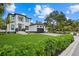 Modern two-story home with a two-car garage and manicured lawn at 577 Venice Ln, Sarasota, FL 34242