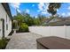 Private backyard with patio, hot tub, and mature landscaping at 577 Venice Ln, Sarasota, FL 34242