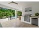 Enjoy a refreshing beverage by the pool at this outdoor patio with a built-in grill at 577 Venice Ln, Sarasota, FL 34242
