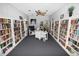 Community library with bookshelves and a work area at 3961 Ashwood Ln # 44, Sarasota, FL 34232