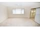 Main bedroom with carpet flooring and access to a sunroom at 3961 Ashwood Ln # 44, Sarasota, FL 34232