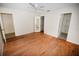 Bright bedroom with wood flooring and mirrored closet doors at 3961 Ashwood Ln # 44, Sarasota, FL 34232
