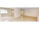 Spacious living room with tile and carpeted floors, and access to sunroom at 3961 Ashwood Ln # 44, Sarasota, FL 34232