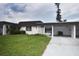Exterior of a villa featuring a carport and neatly landscaped yard at 3961 Ashwood Ln # 44, Sarasota, FL 34232