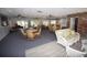 Spacious community room with tables, chairs, and sofas at 3961 Ashwood Ln # 44, Sarasota, FL 34232