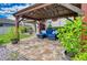 Relaxing patio with pergola, seating, and brick pavers at 8926 Shadyside Ln, Land O Lakes, FL 34637