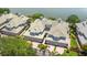 Aerial view of luxury homes with tile roofs and attached garages at 6527 Moorings Point Cir # 101, Lakewood Ranch, FL 34202