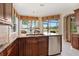 Island kitchen with granite countertops and lake view at 6527 Moorings Point Cir # 101, Lakewood Ranch, FL 34202