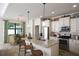 Island kitchen features granite countertops and breakfast nook at 2471 W Price Blvd, North Port, FL 34286