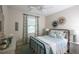 Guest bedroom with metal bed frame and light blue bedding at 2471 W Price Blvd, North Port, FL 34286