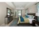 Spacious main bedroom with decorative accents and a ceiling fan at 2471 W Price Blvd, North Port, FL 34286