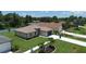 Aerial view of a single-story home with surrounding landscape at 2471 W Price Blvd, North Port, FL 34286