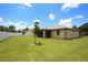 Spacious backyard with grassy lawn and privacy fence at 2471 W Price Blvd, North Port, FL 34286