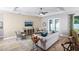 Living room with a neutral color palette, comfortable seating, and large windows at 2471 W Price Blvd, North Port, FL 34286