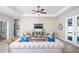 Living room featuring a large sofa, accent chairs, and a neutral color scheme at 2471 W Price Blvd, North Port, FL 34286