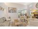 Spacious living room featuring a sofa, chairs, and a large piece of art at 3924 Alamanda Dr, Sarasota, FL 34238