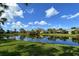 Serene pond with lush landscaping at 3924 Alamanda Dr, Sarasota, FL 34238