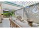 Spacious patio with comfortable seating and retractable shade at 3924 Alamanda Dr, Sarasota, FL 34238