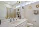 Bathroom boasts a single vanity, shower/tub combo and updated fixtures at 3924 Alamanda Dr, Sarasota, FL 34238